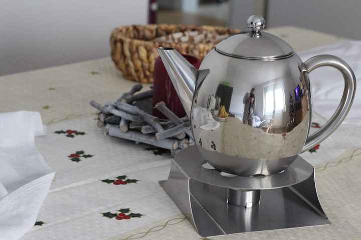 Um bule de chá que eu tanto queria com uma base com vela para manter o  chá quente