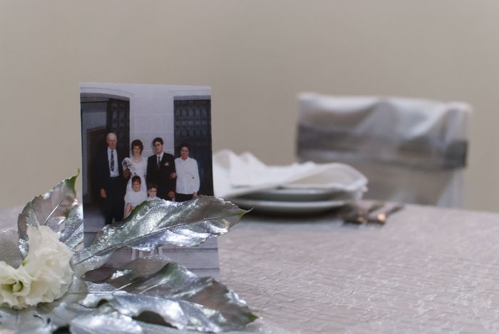 A marcação das mesas foi com fotos do casamento deles