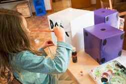 Forrar com papel de embrulho, ou papel celofona ou basicamente com o papel que quiserem e pintar a n