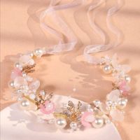 Qual o acessório para a cabeça das meninas das alianças fica melhor com o vestido e laço cor de rosa