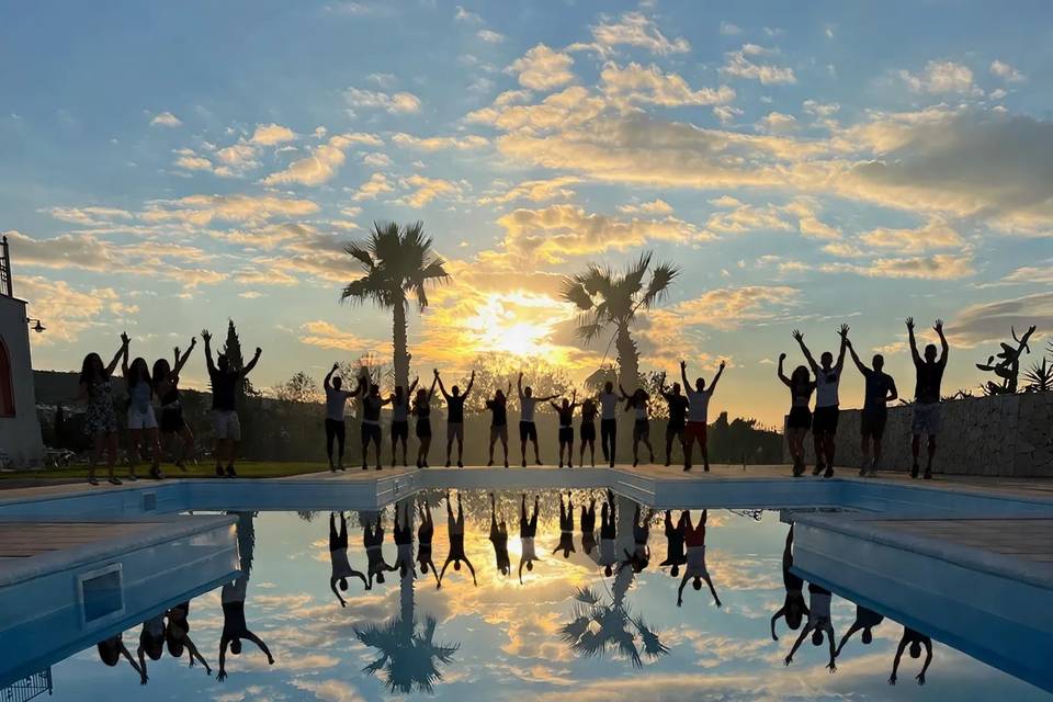 Pool, palms and sunset