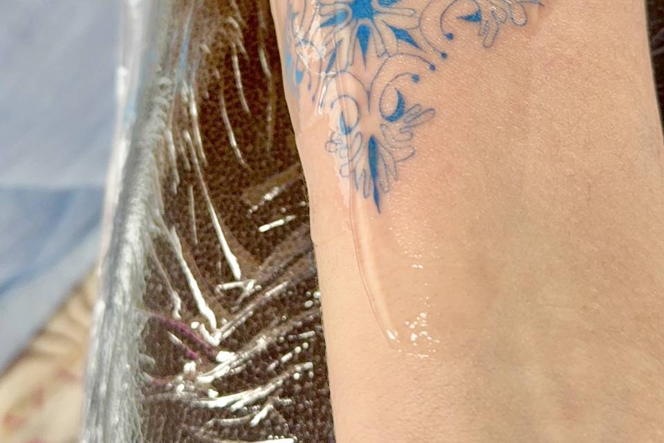 Blue ink tattoo